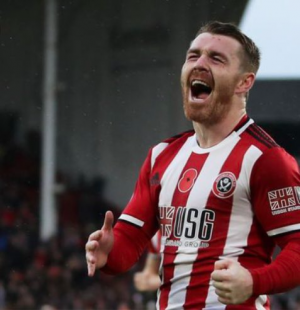 (1) Sheffield United on Twitter_ _John Fleck leaves the field on a stretcher after receiving u...png