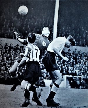 1954-55 March 19 A V Spurs L 5-0 HT0-0 Photo Ringstead challenges Ron Reynolds L Mel Hopkins R.jpg