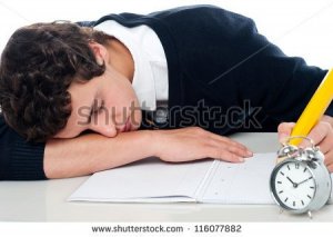 stock-photo-teenager-dozing-off-while-writing-his-test-fast-asleep-116077882.jpg