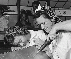 Two women at a Texas Naval Air Base in 1942 wearing snoods.gif