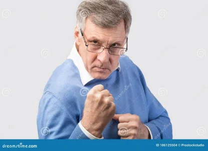 aggressive-senior-man-clenching-fists-ready-to-fight-over-gray-studio-background-standing-pos...webp aggressive-senior-man-clenching-fists-ready-to-fight-over-gray-studio-background-standing-pos...webp