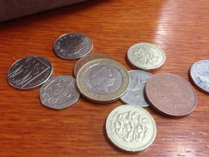english-money-uk-coins-pound-two-founds-ten-pence-twenty-pence-wooden-table-51544070.jpg