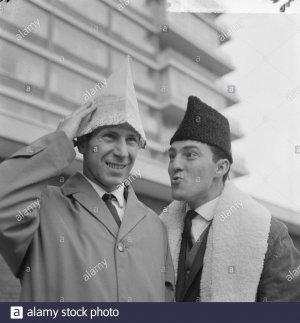 bobby-charlton-and-right-jimmy-greaves-in-front-of-the-hiltonhotel-in-amsterdam-with-hats-on-d...jpg