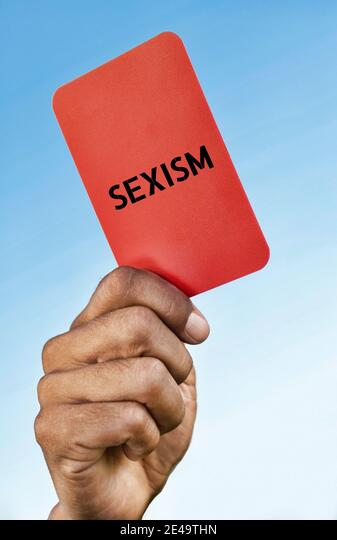 Man holding out a Sexism red card Stock Photo - Alamy