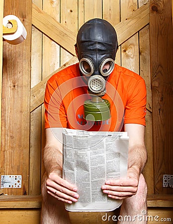 man-gas-mask-sitting-toilet-newspaper-finland-57244242.jpg