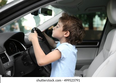 boy-driving-parent-car-260nw-499523791.jpg